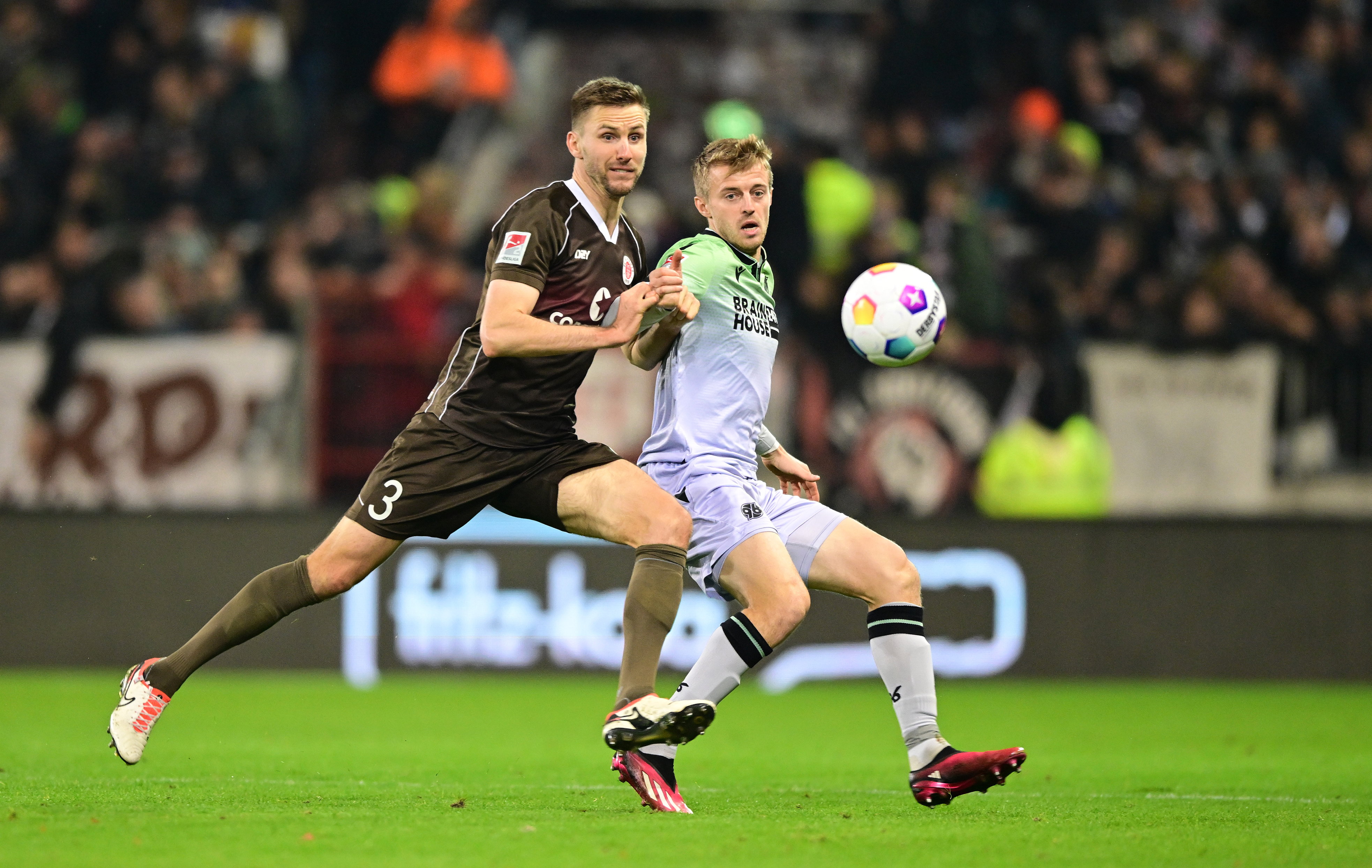 Karol Mets in a duel with Hannover's Sebastian Ernst in the scoreless draw in the reverse fixture.