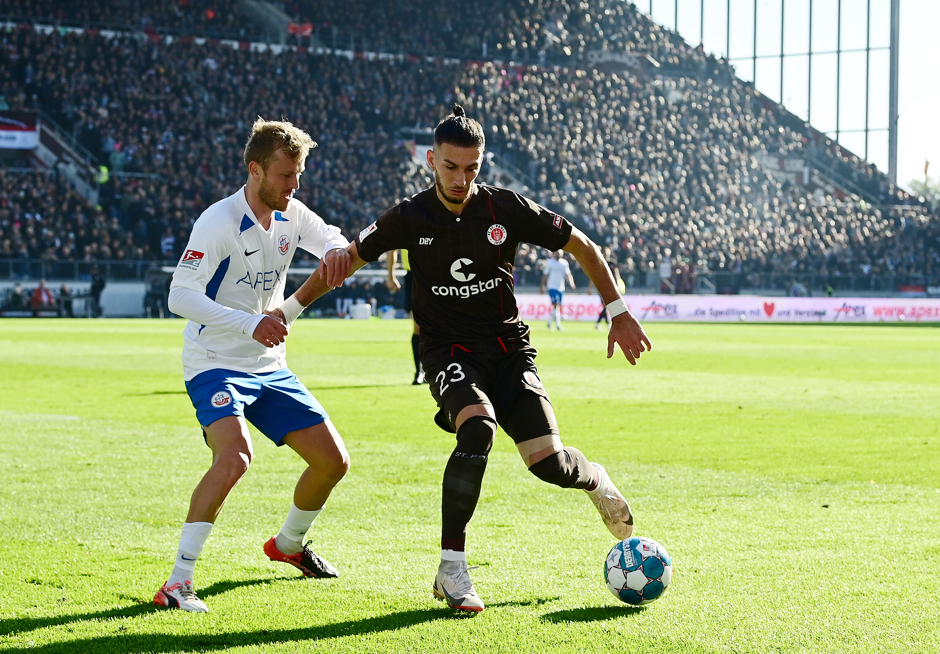 Leart Paqarada, seen here under challenge from Rostock's Nik Omladić, had by far the most touches of any St. Pauli player.