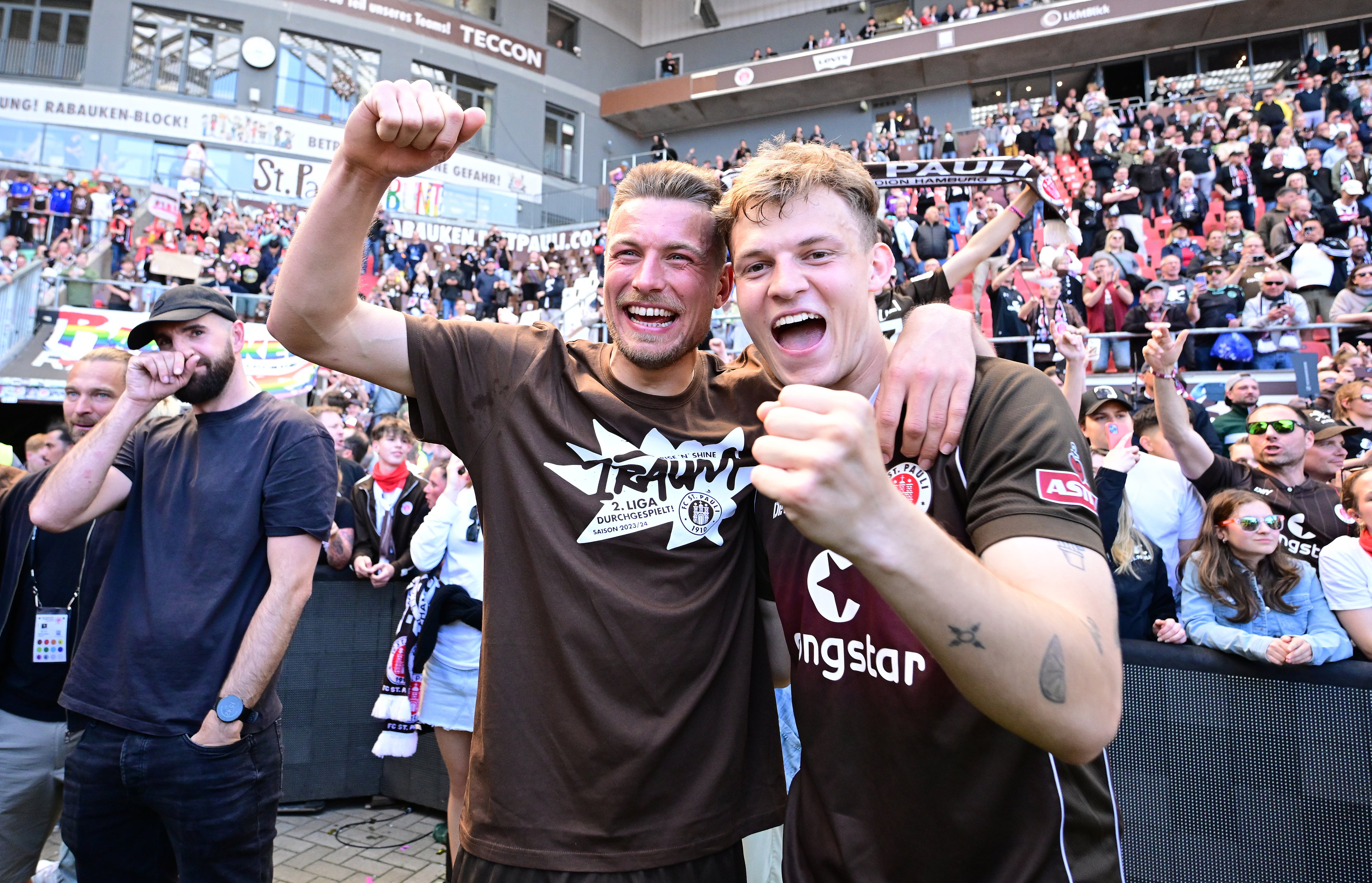 Hauke Wahl and David Nemeth celebrate promotion to the Bundesliga after the 3-1 home win over Osnabrück.
